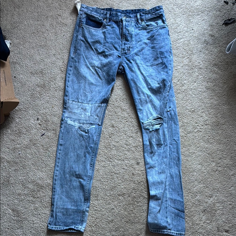 Distressed Blue Denim Jeans